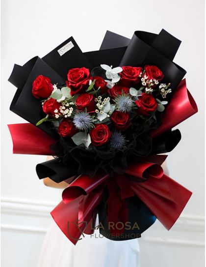 Romantic Valentine - A bouquet of one dozen imported red roses, wax flowers and erygium by LaRosa Flower Shop Quezon City